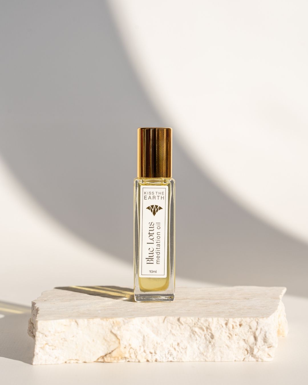 Blue lotus meditation oil from kiss the earth, ancient Egyptian blue lotus hieroglyph text