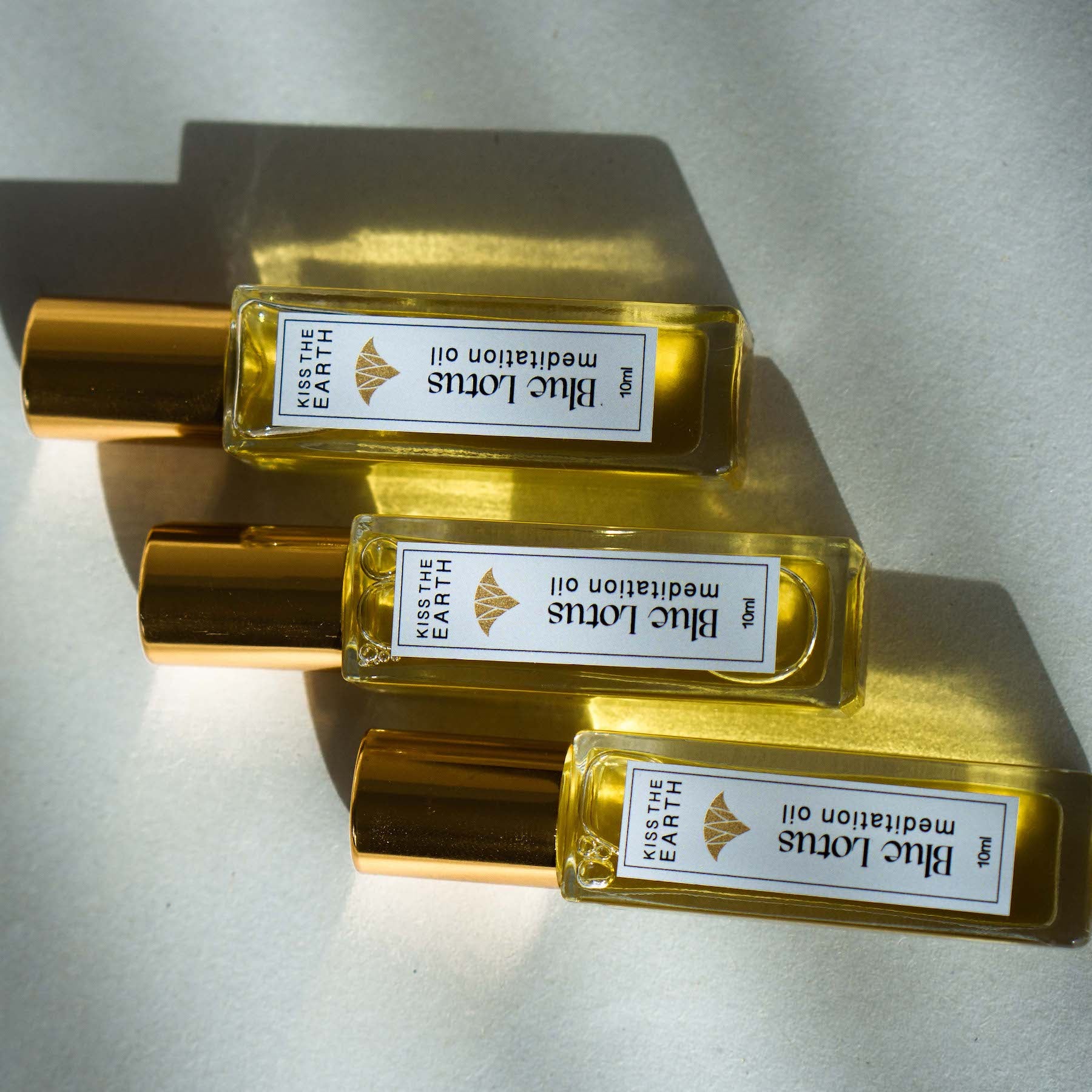 Blue lotus meditation oil from kiss the earth, ancient Egyptian blue lotus hieroglyph text